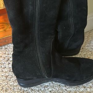 Tall black suede boots with shearling lining